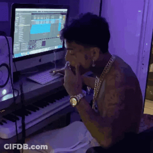 Man Sitting At Computer With Purple Background GIF