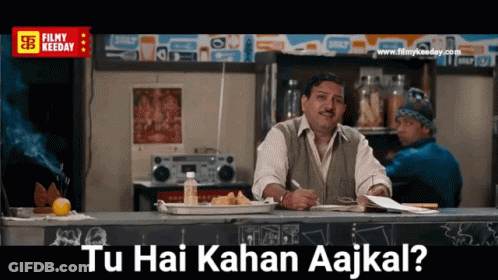 Man Sitting At Counter Tu Hai Kahan Aajkal GIF
