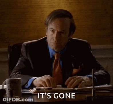 Man Sitting At Desk Poof It's Gone GIF