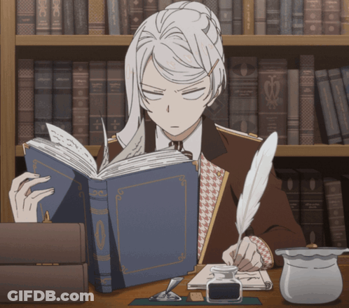 Man Sitting At Desk Reading And Writing GIF