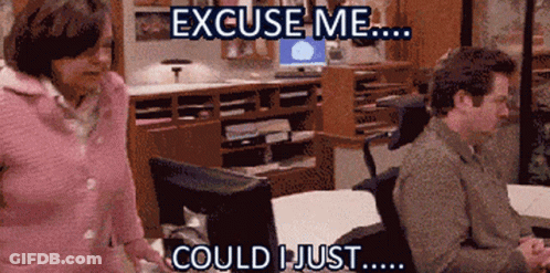 Man Sitting At Desk Saying Excuse Me GIF