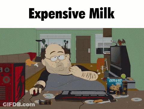 Man Sitting At Desk Saying Expensive Milk GIF