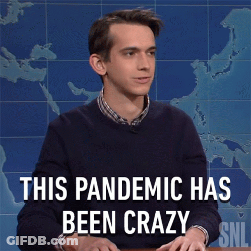 Man Sitting At Desk Saying This Pandemic Has Been Crazy GIF