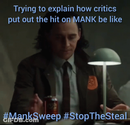 Man Sitting At Desk Trying To Explain Critics Hit On Mank #Mansweep GIF
