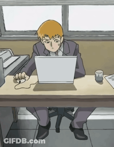 Man Sitting At Desk Using Laptop GIF