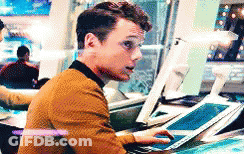 Man Sitting At Desk Using Tablet And Computer GIF
