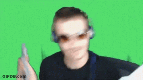 Man Sitting At Desk With Arm In Air GIF