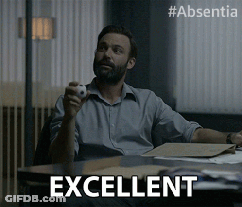 Man Sitting At Desk With Ball And Excellent GIF