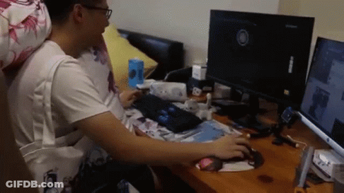 Man Sitting At Desk With Computer Monitor GIF