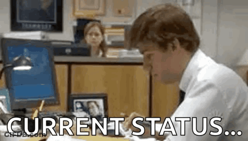 Man Sitting At Desk With Current Status GIF