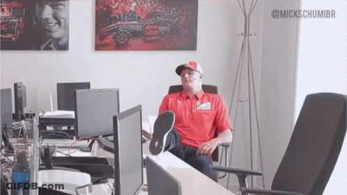 Man Sitting At Desk With Feet Up GIF