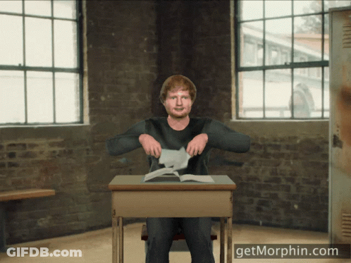 Man Sitting At Desk With Getmorphin.com GIF
