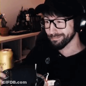 Man Sitting At Desk With Glasses And Headphones GIF