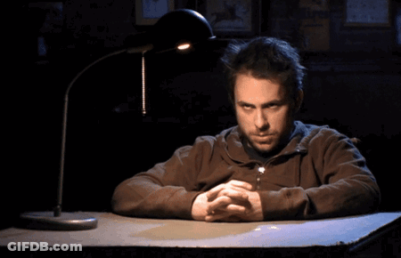 Man Sitting At Desk With Hands Folded GIF