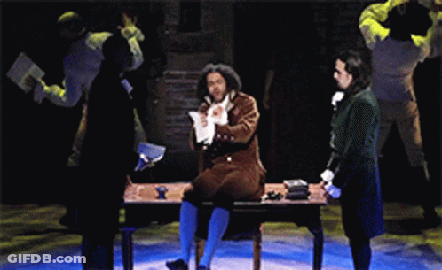 Man Sitting At Desk With Hands In Pockets GIF
