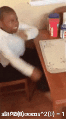 Man Sitting At Desk With Math Problem GIF