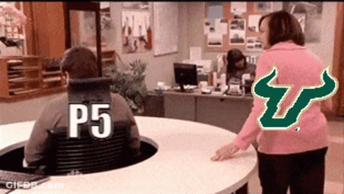 Man Sitting At Desk With P5 On Shirt GIF