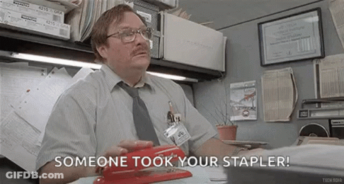 Man Sitting At Desk With Stapler GIF