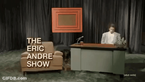 Man Sitting At Desk With The Eric Andre Show GIF