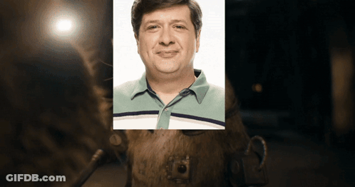 Man Sitting At Desk Writing GIF