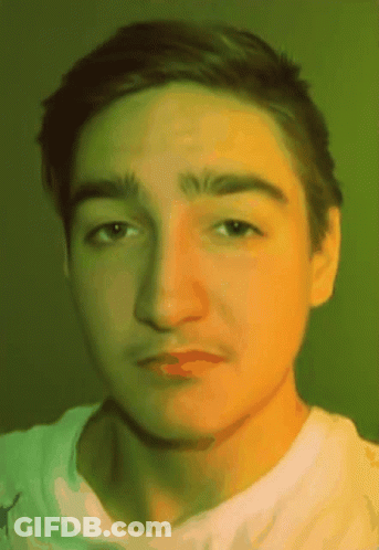 Man Sitting At Desk Writing On Paper GIF