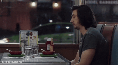 Man Sitting At Diner Table Saying Good Slop GIF