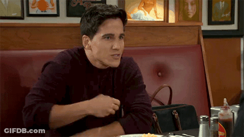 Man Sitting At Diner Table With Plate Of Food GIF