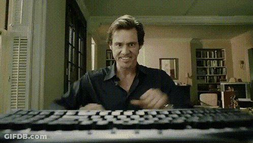 Man Sitting At Keyboard In Living Room GIF