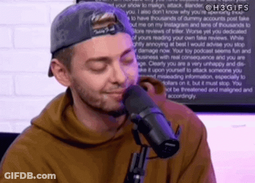 Man Sitting At Microphone Eyes Closed GIF