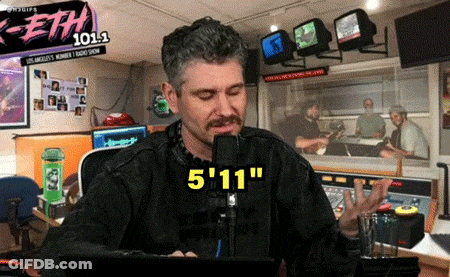 Man Sitting At Microphone With Eth 101.1 Sign GIF