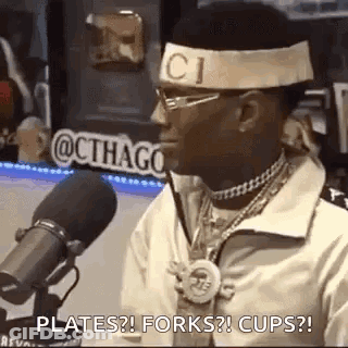 Man Sitting At Microphone With Gucci Headband GIF