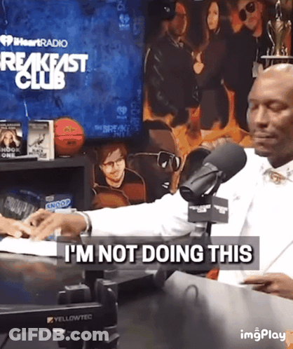 Man Sitting At Microphone With I'm Not Doing This Text GIF