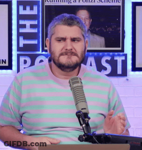 Man Sitting At Microphone With Podcast Sign GIF