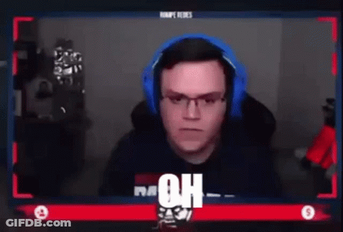 Man Sitting At Screen With Headphones And Glasses GIF
