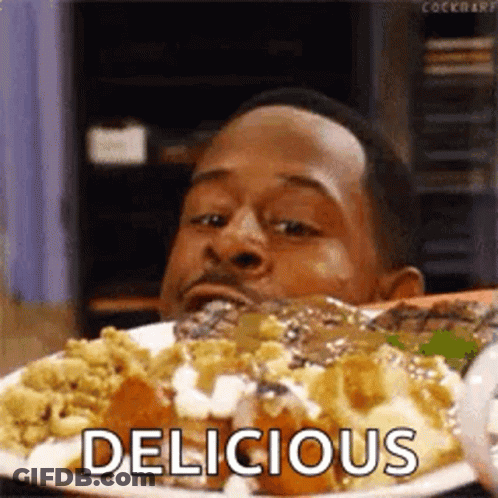 Man Sitting At Table Eating Food GIF