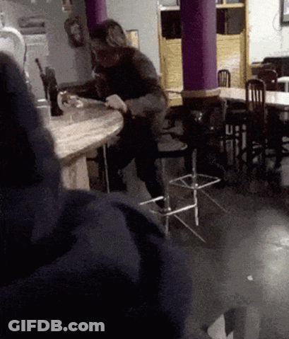 Man Sitting At Table In Restaurant GIF
