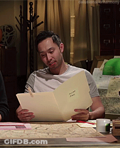 Man Sitting At Table Reading Harmony GIF