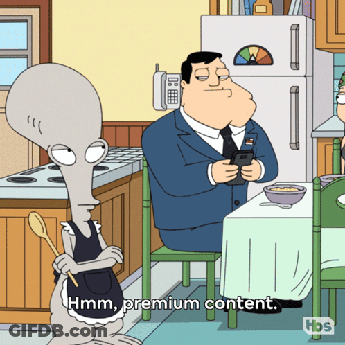 Man Sitting At Table Saying Hmm Premium Content GIF