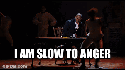 Man Sitting At Table Saying I Am Slow To Anger GIF