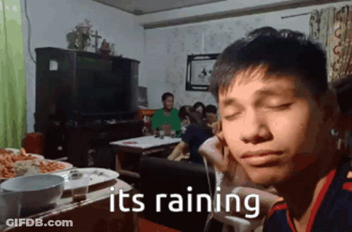 Man Sitting At Table Saying It's Raining GIF