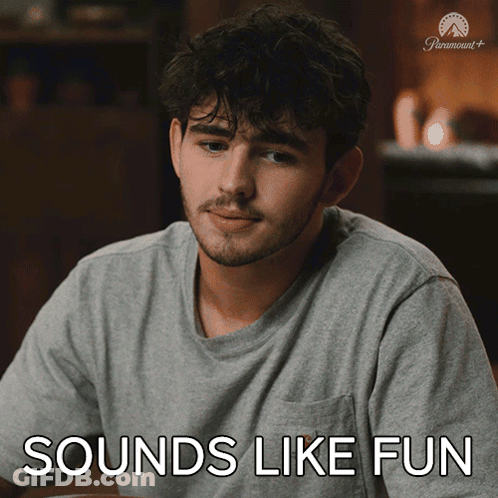 Man Sitting At Table Saying Sounds Like Fun GIF