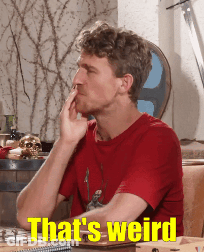 Man Sitting At Table Saying That's Weird GIF