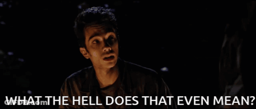 Man Sitting At Table Saying What Do You Mean GIF
