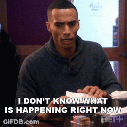 Man Sitting At Table Says I Don't Know What Is Happening Right Now GIF