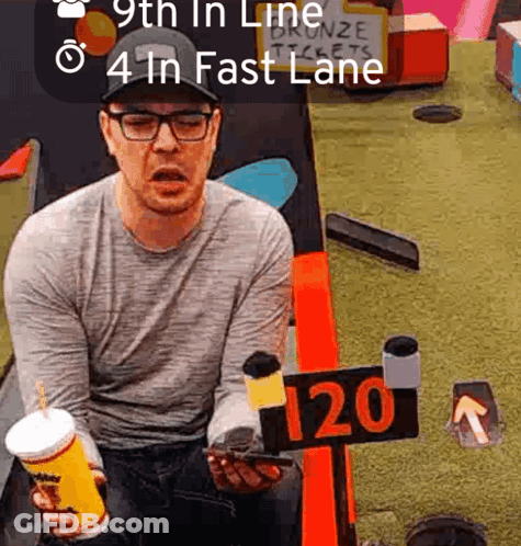 Man Sitting At Table With 120 Sign GIF