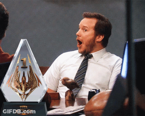 Man Sitting At Table With Attack Trophy GIF