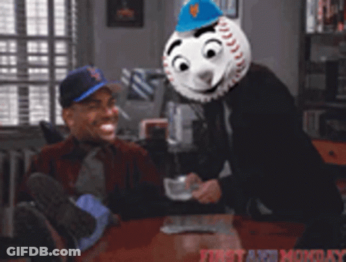 Man Sitting At Table With Baseball Mask GIF