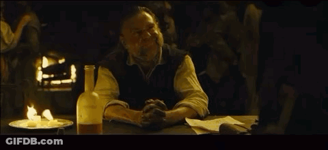 Man Sitting At Table With Beer And Food GIF