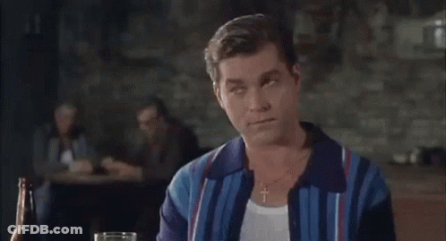 Man Sitting At Table With Beer Bottle And Glass GIF