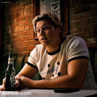 Man Sitting At Table With Beer Bottle GIF